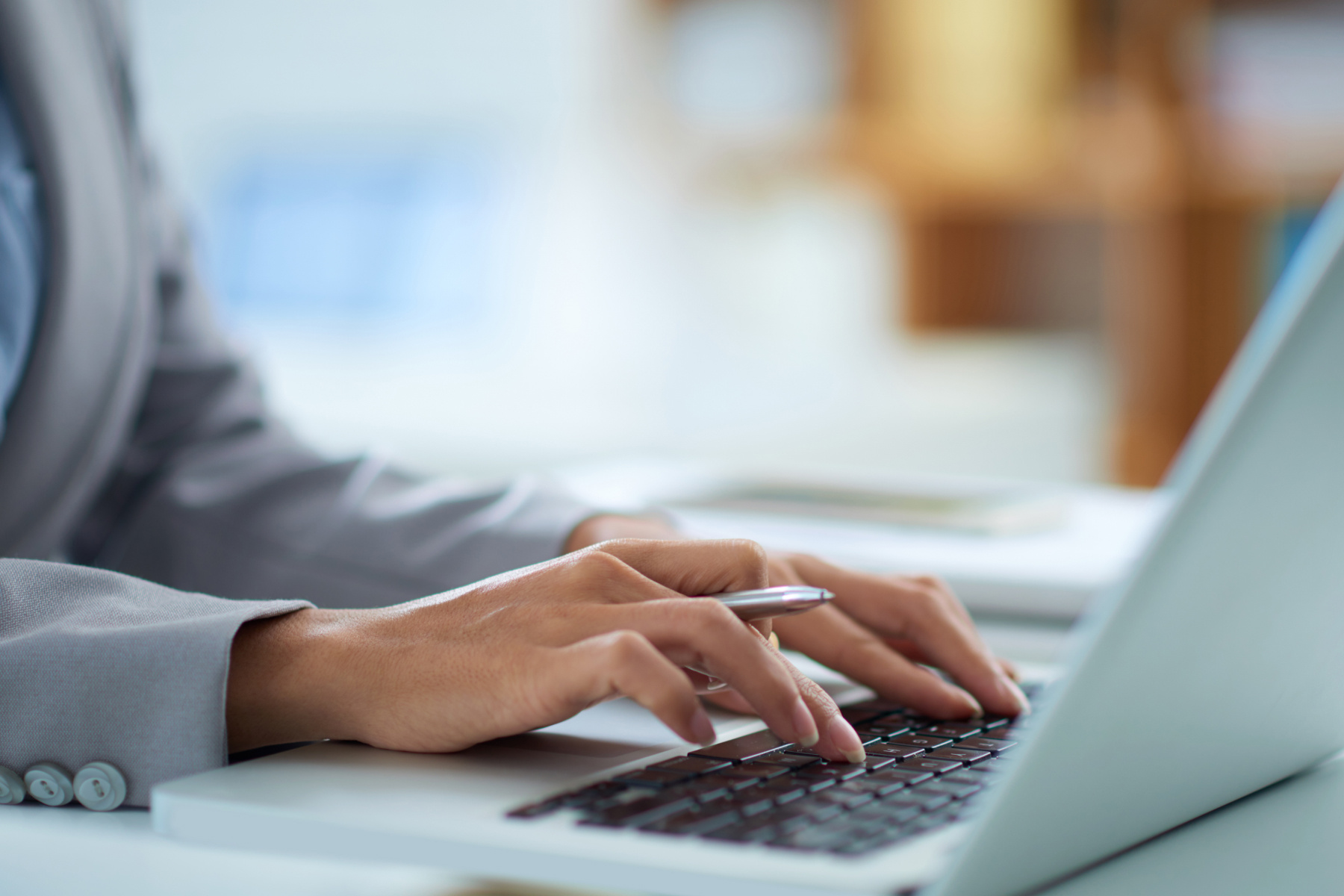 Woman typing on keyboard